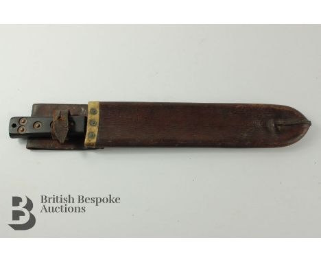 US Martindale military-issue machete 14.5" blade housed in the original leather scabbard.