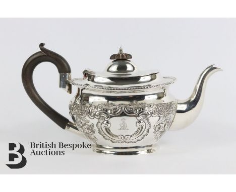 Silver bachelor tea pot, having repoussé decoration, with ebony handle and finial, approx 17 cms in length, Birmingham hallma