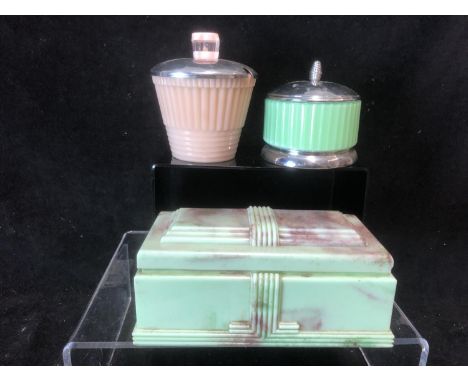 A British Buttner Pipe Co Ltd Cigarette box, of Cenotaph form, cast in mottled green brown urea formaldehyde, integral hinges