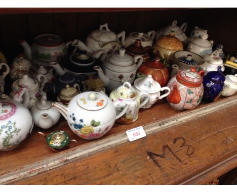 SHELF OF MINIATURE COLLECTORS TEAPOTS