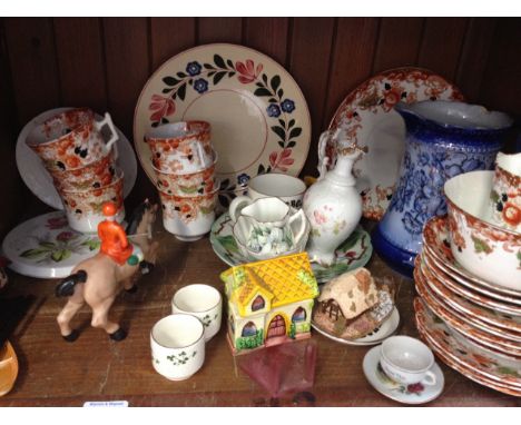 SHELF OF POTTERY