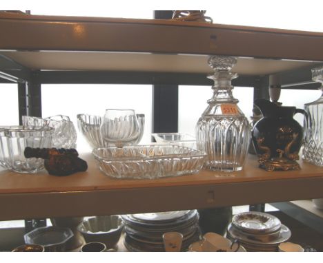 shelf of mixed glassware including decanter