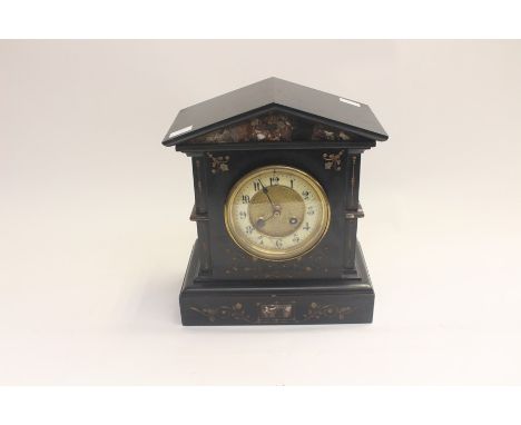 A Victorian black slate and marble inset eight day mantel clock, porcelain dial with Arabic numerals, the case of architectur