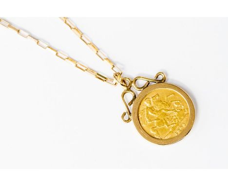An Edward VII 1903 Half Sovereign mounted in a 9ct gold mount and fitted on a 9ct gold fancy link chain, length approx. 17 in