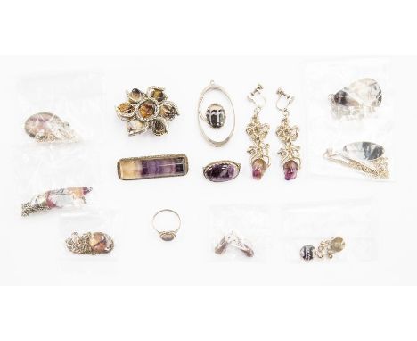 A collection of Blue John jewellery to include silver mounted brooches, pendants, ring and earrings with white metal set vers