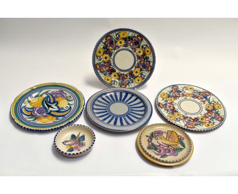A collection of Poole Pottery including four plates, tea pot stand, and a pin dish, all marked to baseCondition: No obvious s