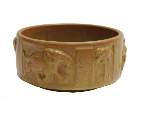 Poole Pottery "Elephant" bowl, decorated with elephants and palms in relief, probably designed by Harold Stabler, impressed m