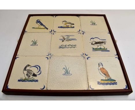 A framed set of nine Poole Pottery tiles of water birds, by Harold Stabler Condition: No obvious signs of damage or restorati