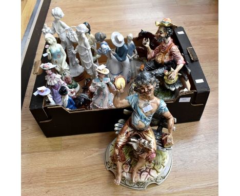 A collection of figures including two Capodimonte seated men no: 817 & 873 signed on the bases; a figural NAO group; a REX Va