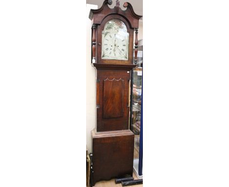 A George III mahogany cased eight day long case clock, the white enamelled dial with hand painted decoration, the hood with a