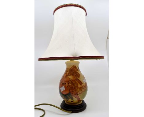 Late 20th Century Moorcroft table lamp, with original shade, bird and fruit design, orange ground