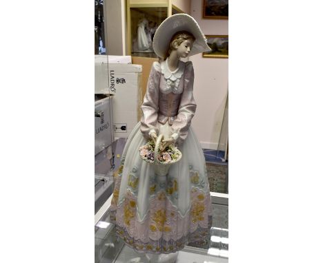 Very large Lladro figure of a lady "Spring Courtship" no 1818.Condition: One flower petal chipped, otherwise in good conditio