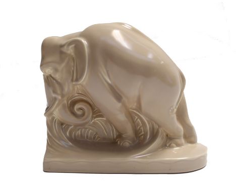 Single Poole pottery elephant book end designed by Harold Brownsword, circa 1930, marked to base, 19x17 cmCondition: A small 