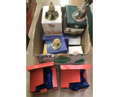 A Lilliput Lane collection including Spring Gate Cottage, Lock Ness Lodge, The Nutshell, Granny Smiths, Cotman Cottage miniat