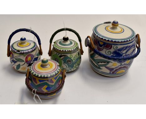 Four Poole Pottery barrels with wicker handles, three for jam and large one for biscuits, all marked to baseCondition: One ha
