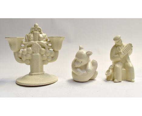 Poole Pottery white glaze bear, accordion player and a double candlestick, all marked to baseCondition: Bear appears to have 