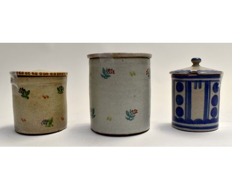 3 Poole pottery jam pots and lids, two decorated with small flower sprays, third with art deco style decoration, all marked t