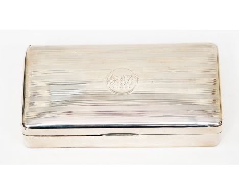 A silver cigarette box, rectangular form with engine turned patterning, round cartouche inscribed J.B.G 1899-1924, maker mark