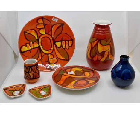 A collection of seven items including Poole Pottery, three vases and four dishes, orange and red ground, along with one blue 