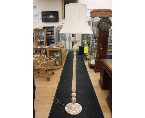 A 20th Century painted cream and gold standard lamp with&nbsp; turned reed column,&nbsp;