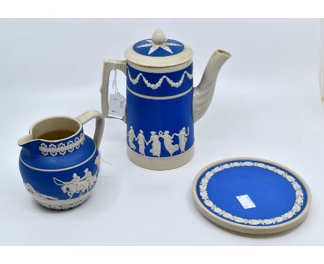 A Copeland Spode early 20th Century coffee pot and stand together with a milk jug, applied white decoration on blue ground (3