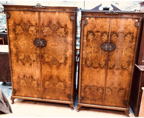 A pair of Art Deco burr walnut inlay his and hers wardrobes, circa 1930, made by L Marcus Ltd, London, moulded cornice with s