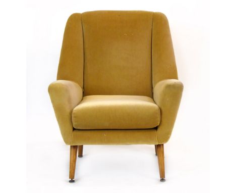 A 1950's pale green upholstered armchair with beech tapering legs CONDITION REPORT: Wear commensurate with age and use. Struc