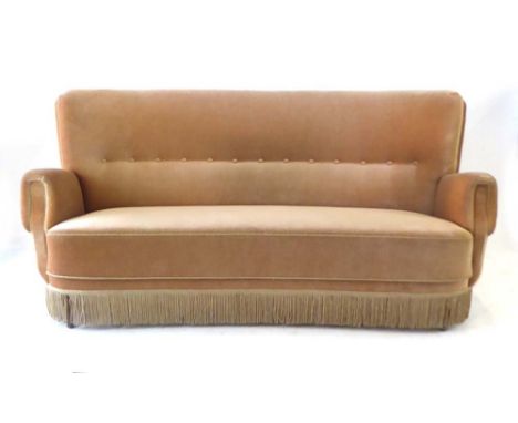 A 1950's draylon and button upholstered two-seater sofa with a bow back, on mahogany legs with brass caps, l. 162 cm