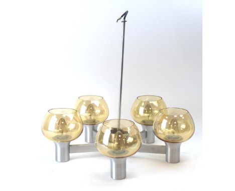 A spun aluminium five-branch ceiling light with yellow glass shades