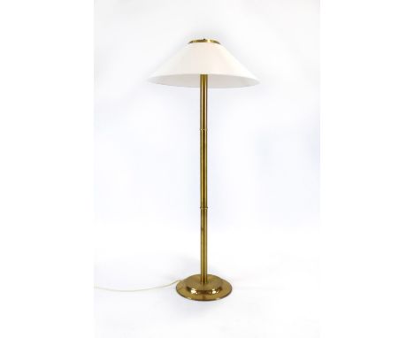A 1970's brass tubular standard lamp with an open white shade on a straight shaft CONDITION REPORT: EU plug will need replaci
