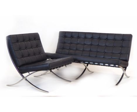 After Ludwig Mies van der Rohe, a 'Barcelona'-type black button upholstered sofa, together with a matching armchair CONDITION