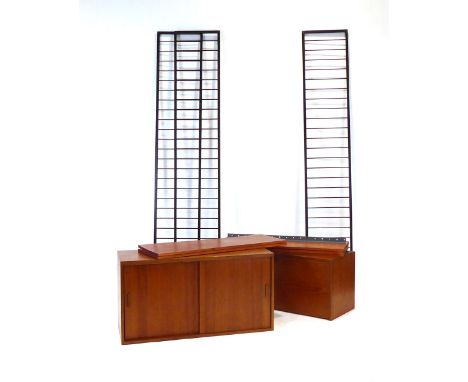 A Staples Ladderax teak modular shelving system, the bureau and sliding door cabinet with unusual handles and cushioned top r