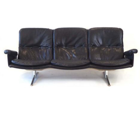 Werner Lagenfeld for Esa, a Danish black leather and button upholstered three-seater sofa on a polished aluminium base, l. 21