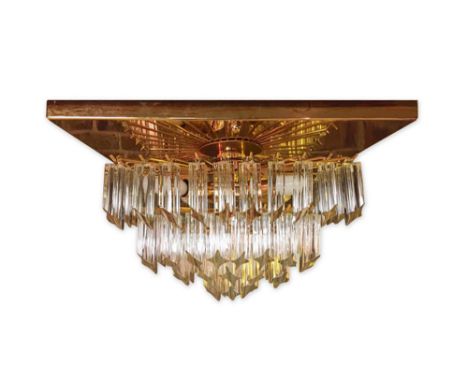An Italian plaffonier/chandelier by Veneziana, the gold finished mounting plate supporting four tiers of cruciform glass elem