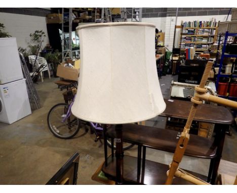 Turned oak standard lamp on tripod support. All electrical items in this lot have been PAT tested for safety and have passed.