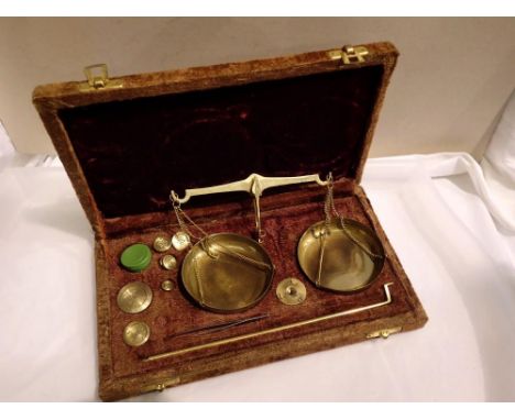 Velvet cased brass scales set with weights. UK P&amp;P Group 1 (£16+VAT for the first lot and £2+VAT for subsequent lots) 