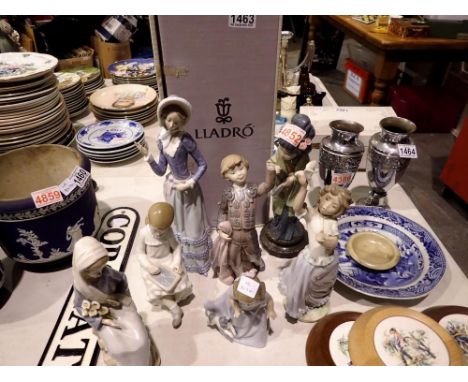 Quantity of Lladro and Nao figurines, all with faults, one boxed. Not available for in-house P&amp;P 