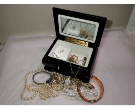 Costume jewellery within a musical box. UK P&amp;P Group 1 (£16+VAT for the first lot and £2+VAT for subsequent lots) 