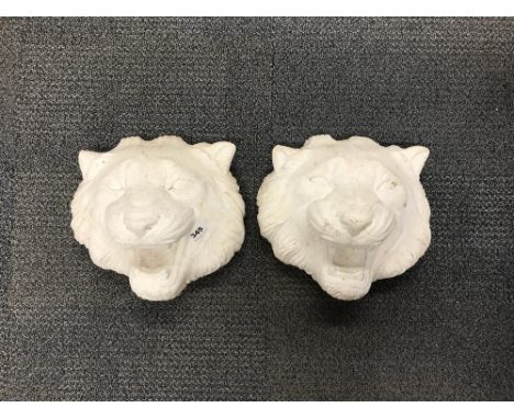 A pair of large vintage concrete garden lion's heads, W. 33, L 32cm.