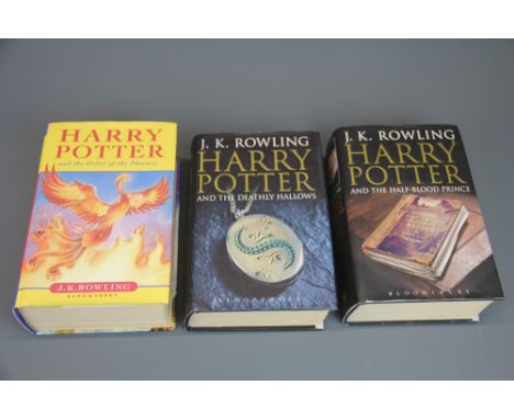 Three first edition hardback J.K Rowling Harry Potter novels, including 'Harry Potter and the Half-Blood Prince' with rare mi