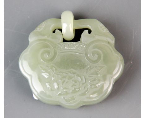 A lovely Chinese carved celadon green jade lock, decorated with flowers, W. 5cm, H. 4.5cm.