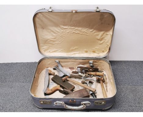 A vintage travelling case and tool contents.