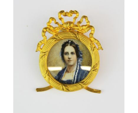 A 19th century gilt framed hand painted portrait miniature of a lady in blue, L. 6cm.