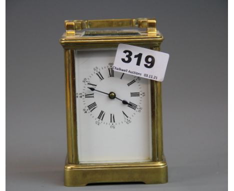A gilt brass carriage clock, understood to be in working order, H. 15cm.