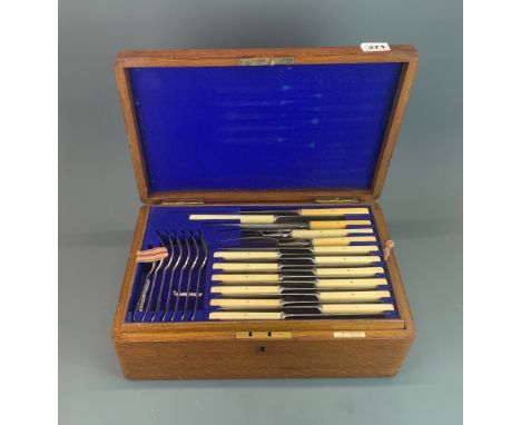 An extensive oak cased silver plated cutlery set, case size 42 x 27 x 15cm.