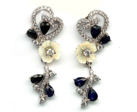 A pair of 925 silver drop earrings set with carved mother of pearl, sapphires and white stones, L. 3cm.