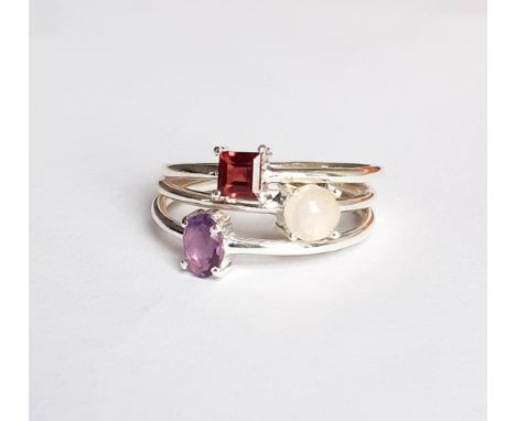 Three 925 silver stacking rings set with opal, amethyst and garnet, (S).