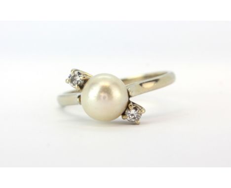 An 18ct white gold (stamped 750) ring set with pearl and brilliant cut diamonds, (R).