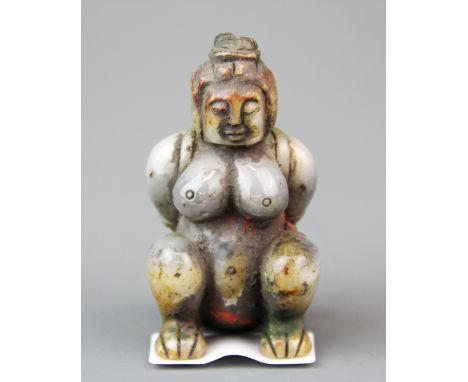 An unusual Chinese carved mixed colour jade figure of a naked woman in bondage (possibly an Imperial pillow figure). H. 7.5cm