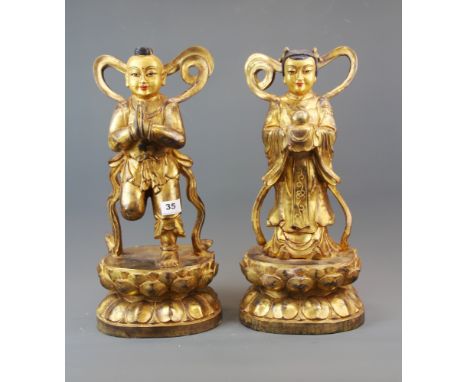 A pair of superb large Tibetan gilt bronze figures of Buddhist angels, H. 46cm.